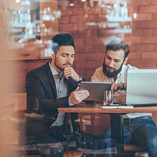 Meet at business meeting in restaurant with computers