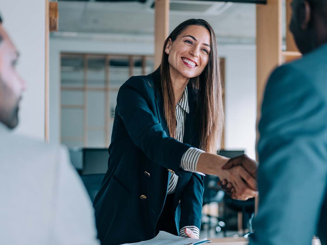 Business people shaking hands in office